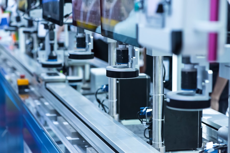 fixed automated machine used in a phone factory